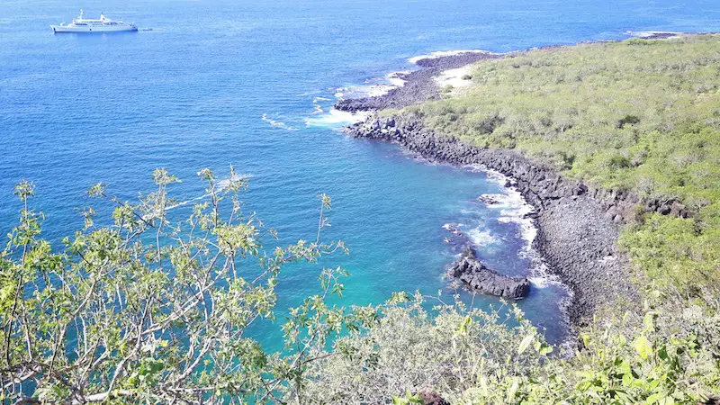 View from above of the turquoise Darwin's Cove from Cerro Tijeretas, San Cristobal, Galapagos.