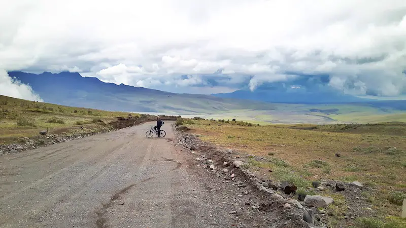 Man biking down from after Cotopaxi hike, Ecuador.