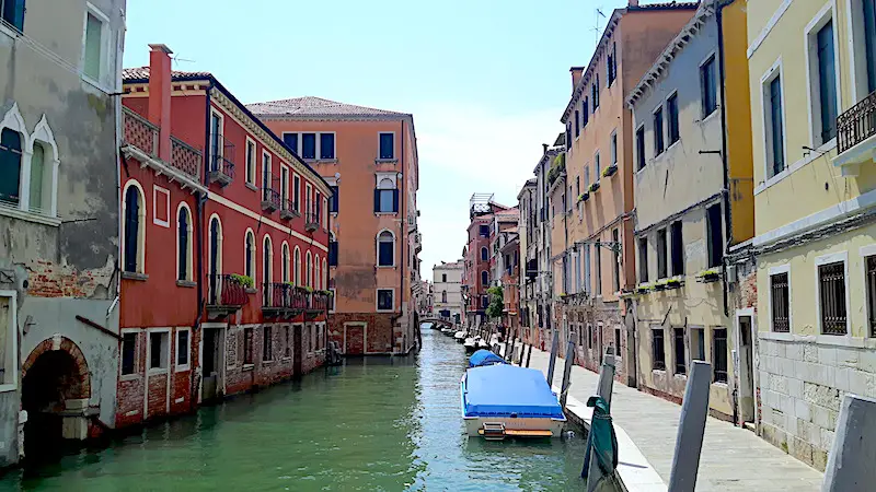 Exploring Venice along a quiet canal in Italy.